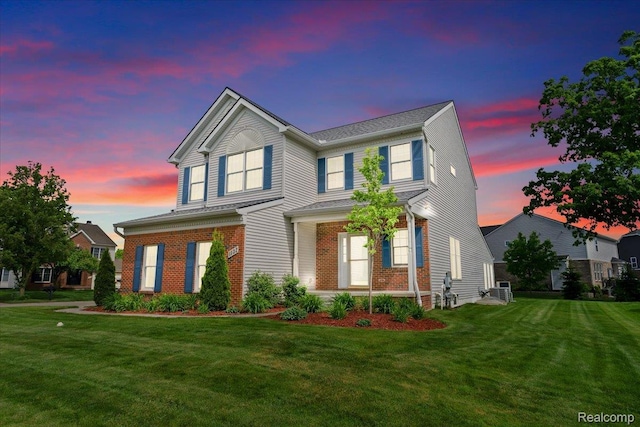 1132 Cantor Ln, South Lyon, MI 48178 - view of front of home featuring brick siding and a front lawn