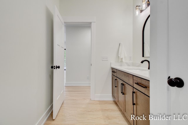 7134 Sugar Maple Dr, Hudsonville, MI 49426 - bathroom featuring vanity, wood finished floors, and baseboards