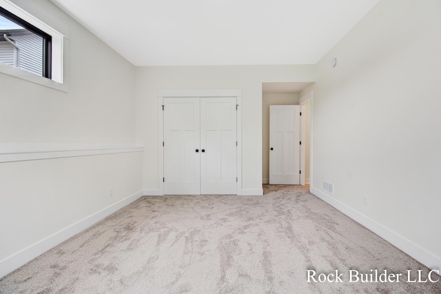 7134 Sugar Maple Dr, Hudsonville, MI 49426 - unfurnished bedroom with carpet, baseboards, and a closet