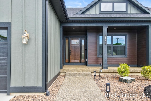 7134 Sugar Maple Dr, Hudsonville, MI 49426 - doorway to property featuring roof with shingles and board and batten siding