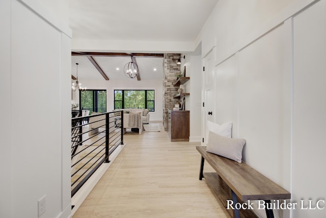 7134 Sugar Maple Dr, Hudsonville, MI 49426 - hall with a chandelier, light wood-style flooring, and beamed ceiling
