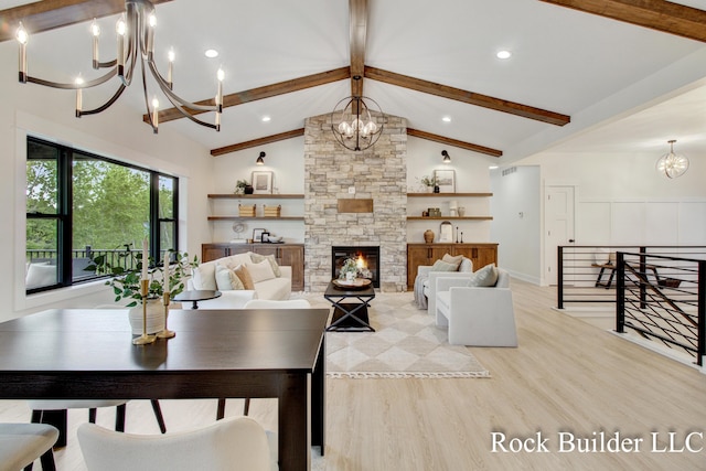 7134 Sugar Maple Dr, Hudsonville, MI 49426 - living area with a chandelier, beamed ceiling, light wood-type flooring, a stone fireplace, and high vaulted ceiling
