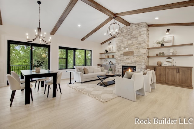 7134 Sugar Maple Dr, Hudsonville, MI 49426 - living area featuring a chandelier, light wood finished floors, a stone fireplace, and recessed lighting