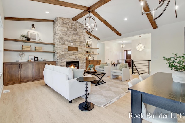 7134 Sugar Maple Dr, Hudsonville, MI 49426 - living room featuring a chandelier, light wood finished floors, and a fireplace