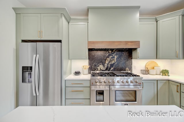 7134 Sugar Maple Dr, Hudsonville, MI 49426 - kitchen featuring stainless steel appliances, custom exhaust hood, and tasteful backsplash