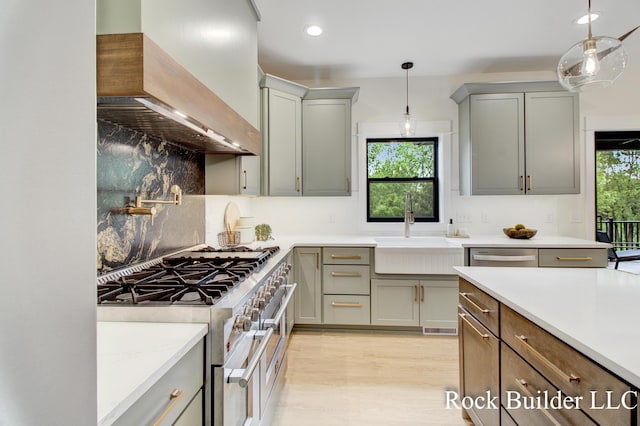 7134 Sugar Maple Dr, Hudsonville, MI 49426 - kitchen with custom exhaust hood, appliances with stainless steel finishes, a sink, tasteful backsplash, and recessed lighting