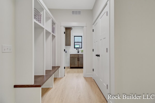 7134 Sugar Maple Dr, Hudsonville, MI 49426 - mudroom with light wood finished floors and baseboards