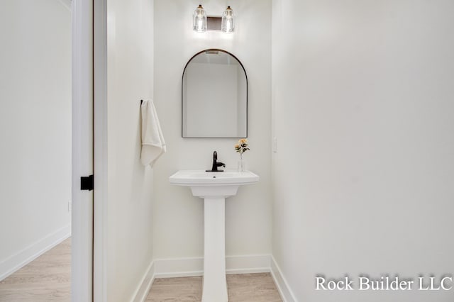 7134 Sugar Maple Dr, Hudsonville, MI 49426 - bathroom with wood finished floors and baseboards