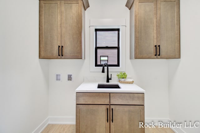 7134 Sugar Maple Dr, Hudsonville, MI 49426 - bathroom featuring baseboards, wood finished floors, and vanity