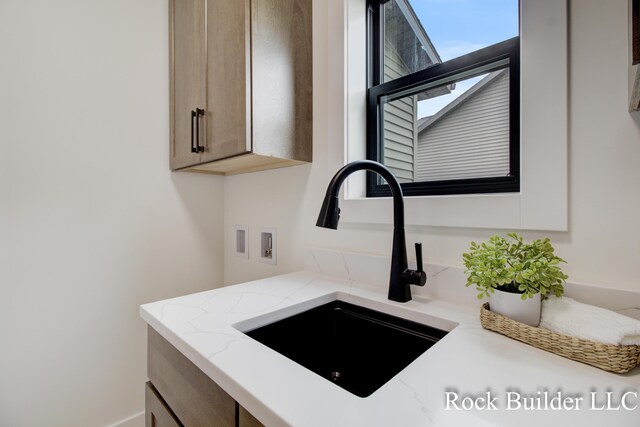 7134 Sugar Maple Dr, Hudsonville, MI 49426 - kitchen view of a sink and light stone countertops