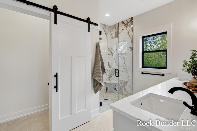 7134 Sugar Maple Dr, Hudsonville, MI 49426 - bathroom featuring a marble finish shower, double vanity, recessed lighting, and baseboards