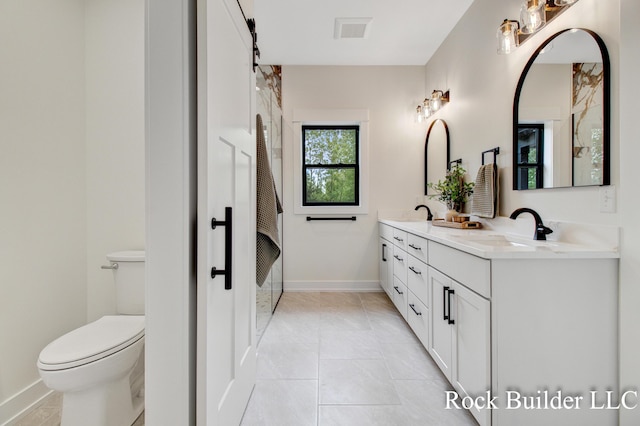 7134 Sugar Maple Dr, Hudsonville, MI 49426 - bathroom featuring double vanity, toilet, baseboards, and tile patterned flooring