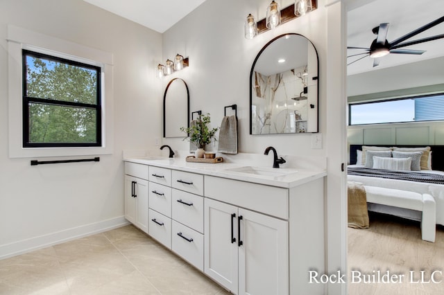 7134 Sugar Maple Dr, Hudsonville, MI 49426 - bathroom featuring connected bathroom, a ceiling fan, plenty of natural light, and double vanity