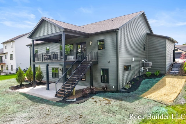 7134 Sugar Maple Dr, Hudsonville, MI 49426 - rear view of property featuring stairway, a patio area, and roof with shingles