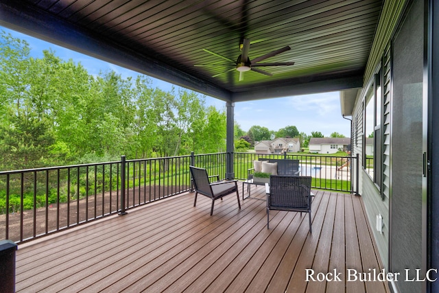7134 Sugar Maple Dr, Hudsonville, MI 49426 - deck featuring ceiling fan and view of scattered trees