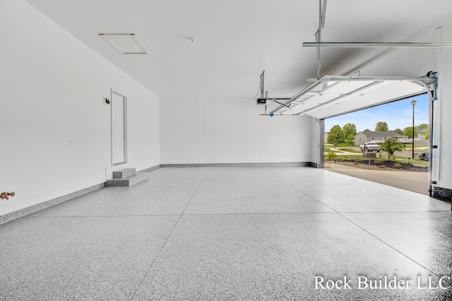 7134 Sugar Maple Dr, Hudsonville, MI 49426 - garage with baseboards and a garage door opener
