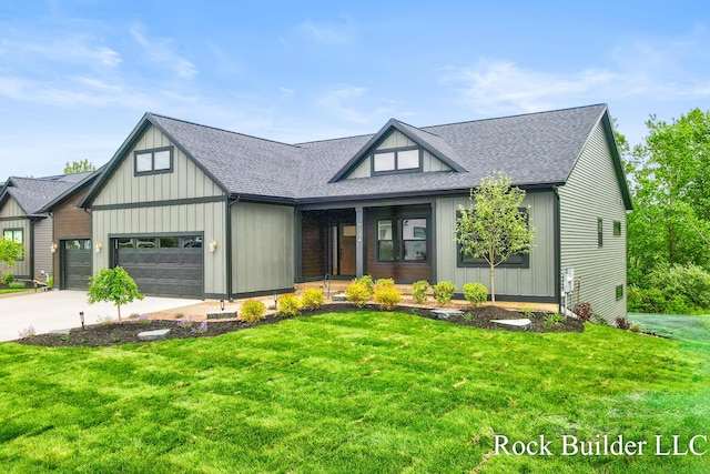 7134 Sugar Maple Dr, Hudsonville, MI 49426 - view of front facade featuring an attached garage, a front yard, a shingled roof, and concrete driveway