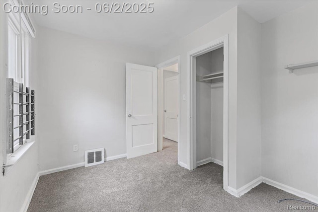 18697 Sunderland Rd, Detroit, MI 48219 - unfurnished bedroom featuring carpet, a closet, and baseboards