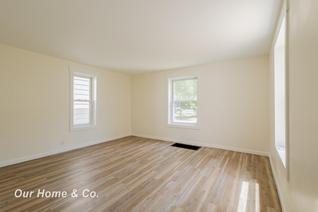 337 N Fairview Ave, Lansing, MI 48912 - spare room with healthy amount of natural light, light wood-type flooring, and baseboards