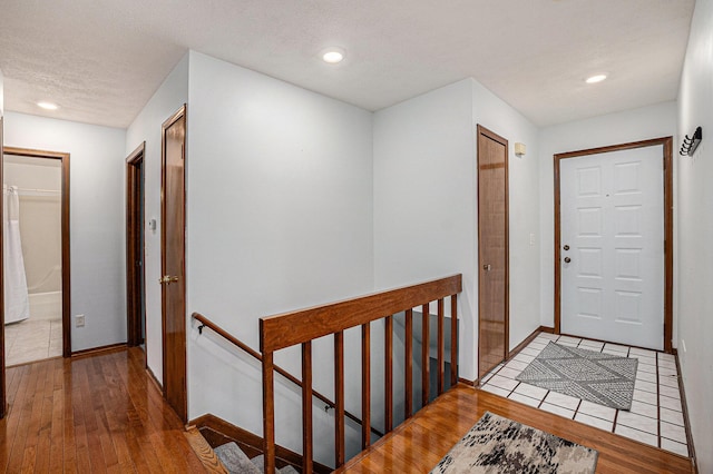 6400 Chestnut Hill Ct, Clarkston, MI 48346 - corridor featuring an upstairs landing, hardwood / wood-style flooring, baseboards, and recessed lighting