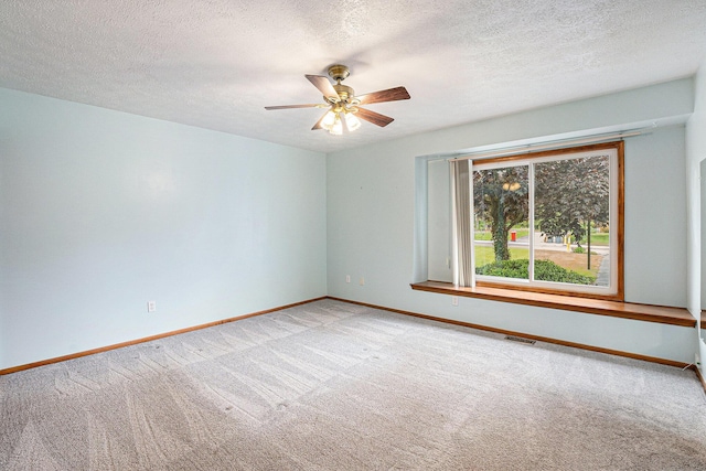 6400 Chestnut Hill Ct, Clarkston, MI 48346 - empty room featuring carpet floors, a ceiling fan, baseboards, and a textured ceiling