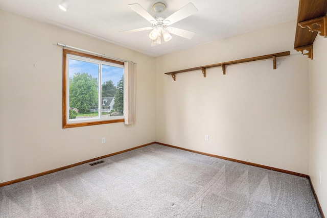 6400 Chestnut Hill Ct, Clarkston, MI 48346 - spare room featuring carpet, a ceiling fan, and baseboards