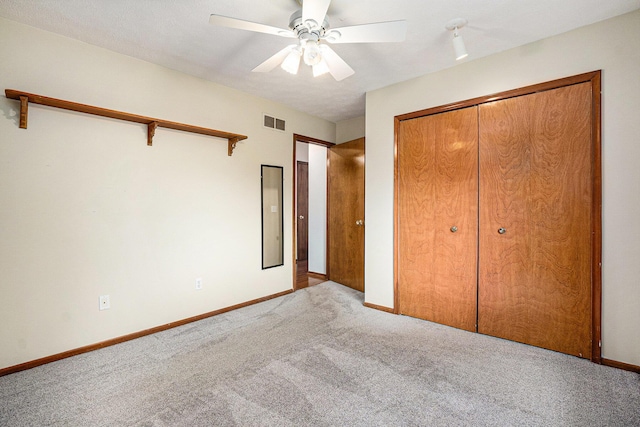 6400 Chestnut Hill Ct, Clarkston, MI 48346 - unfurnished bedroom featuring carpet, baseboards, ceiling fan, and a closet