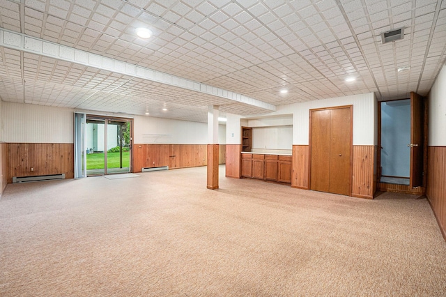 6400 Chestnut Hill Ct, Clarkston, MI 48346 - below grade area featuring a wainscoted wall, wooden walls, a baseboard heating unit, and light carpet
