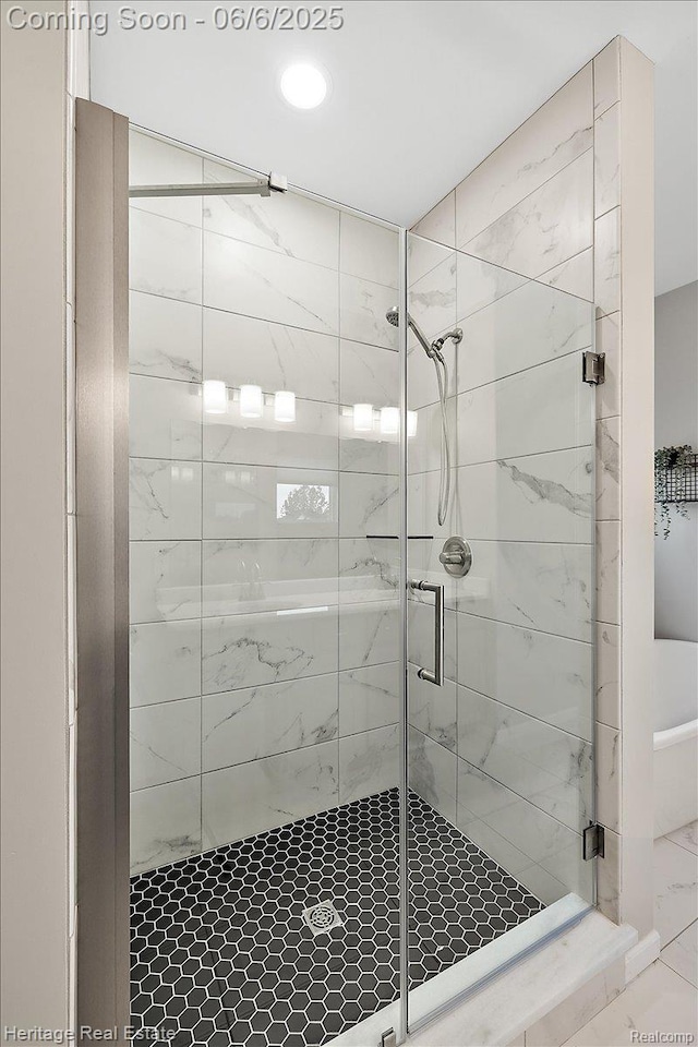 6231 Leighland Dr, Grand Blanc, MI 48439 - bathroom with a stall shower, marble finish floors, and recessed lighting