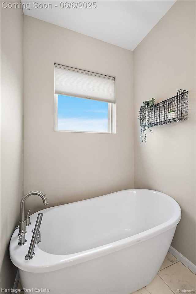 6231 Leighland Dr, Grand Blanc, MI 48439 - bathroom featuring a freestanding tub