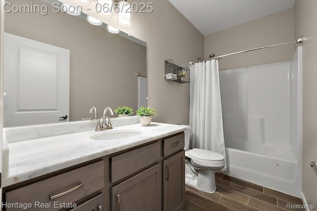 6231 Leighland Dr, Grand Blanc, MI 48439 - bathroom featuring wood finish floors, vanity, toilet, and shower / tub combo