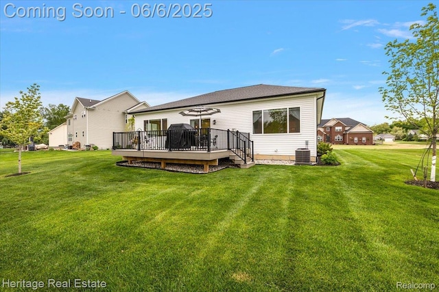 6231 Leighland Dr, Grand Blanc, MI 48439 - back of house with a yard, a deck, and central AC unit