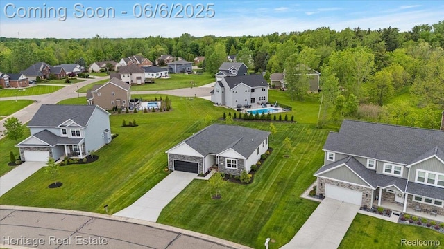 6231 Leighland Dr, Grand Blanc, MI 48439 - aerial view of residential area with a heavily wooded area