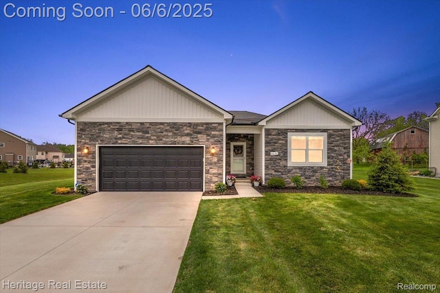 6231 Leighland Dr, Grand Blanc, MI 48439 - view of front of house with stone siding, a yard, a garage, and driveway
