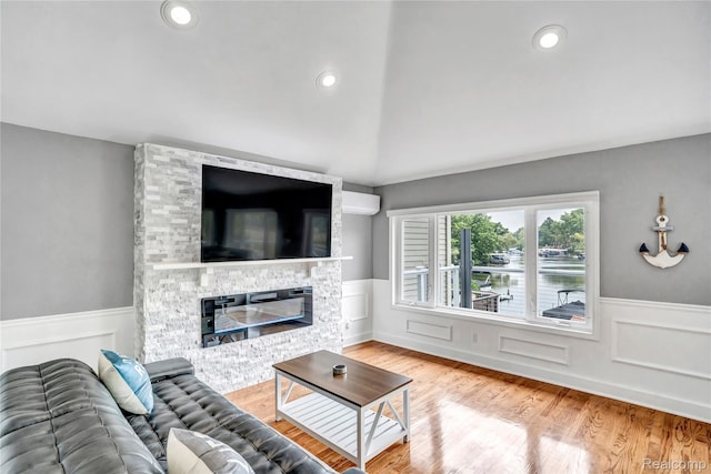 533 Bellevue Ave, Lake Orion, MI 48362 - living room with a wainscoted wall, a fireplace, and wood finished floors