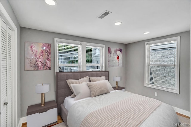 533 Bellevue Ave, Lake Orion, MI 48362 - bedroom featuring recessed lighting, a closet, and wood finished floors