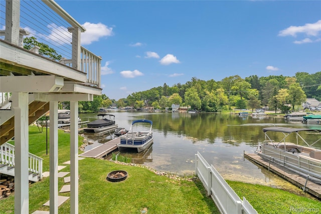 533 Bellevue Ave, Lake Orion, MI 48362 - dock featuring a water view, a lawn, and a fire pit