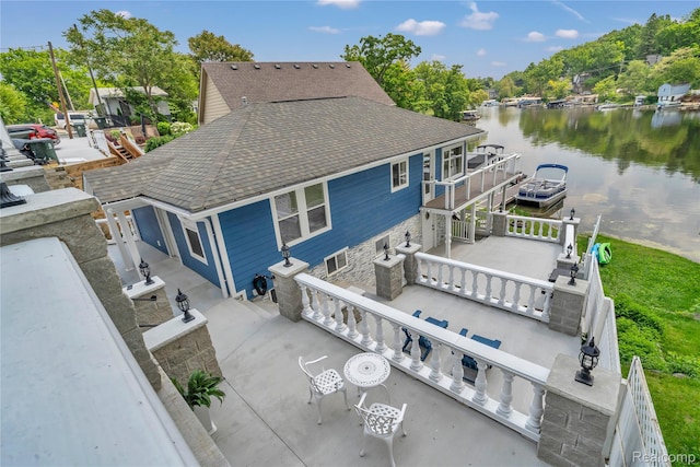 533 Bellevue Ave, Lake Orion, MI 48362 - rear view of property featuring area for grilling, roof with shingles, and a water view