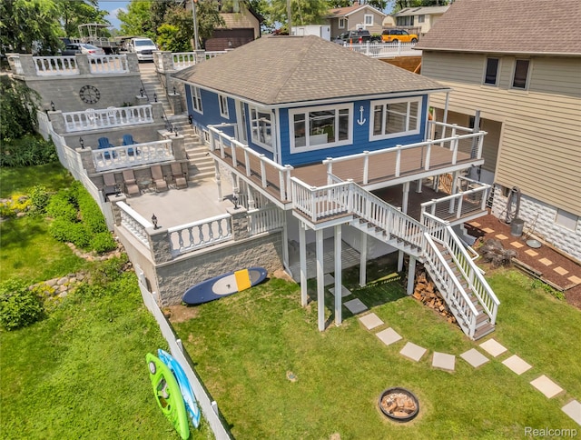 533 Bellevue Ave, Lake Orion, MI 48362 - back of property featuring stairs, roof with shingles, a wooden deck, and a yard