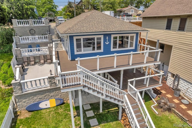 533 Bellevue Ave, Lake Orion, MI 48362 - rear view of property featuring stairway, roof with shingles, and a wooden deck