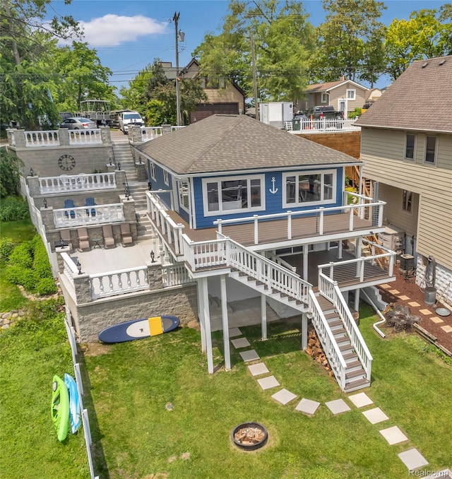 533 Bellevue Ave, Lake Orion, MI 48362 - back of house featuring stairway, a shingled roof, a yard, and a wooden deck