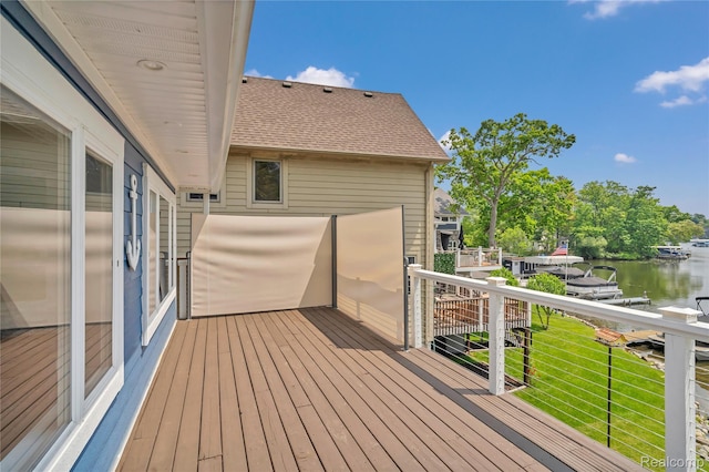 533 Bellevue Ave, Lake Orion, MI 48362 - wooden terrace with a water view and a lawn