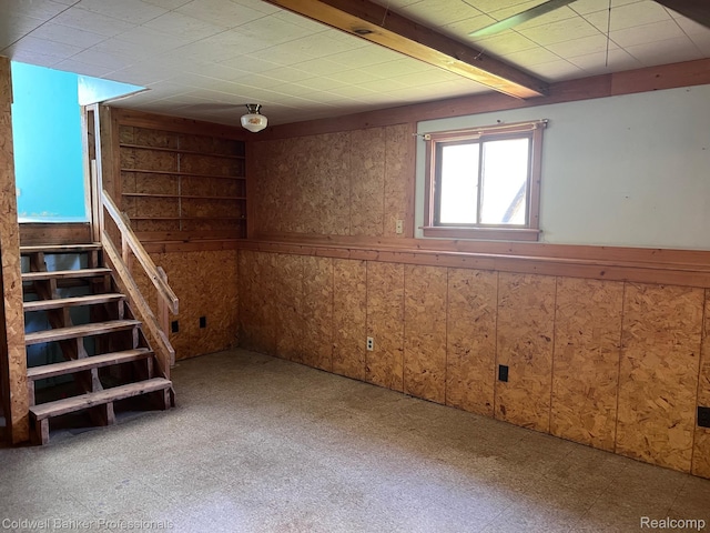 158 W Willow St, Perry, MI 48872 - basement featuring tile patterned floors, a wainscoted wall, wooden walls, and stairway