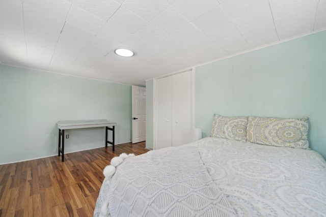 229 Water St, Grass Lake, MI 49240 - bedroom with wood finished floors, a closet, and crown molding