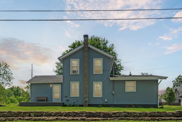 229 Water St, Grass Lake, MI 49240 - rear view of house featuring a yard