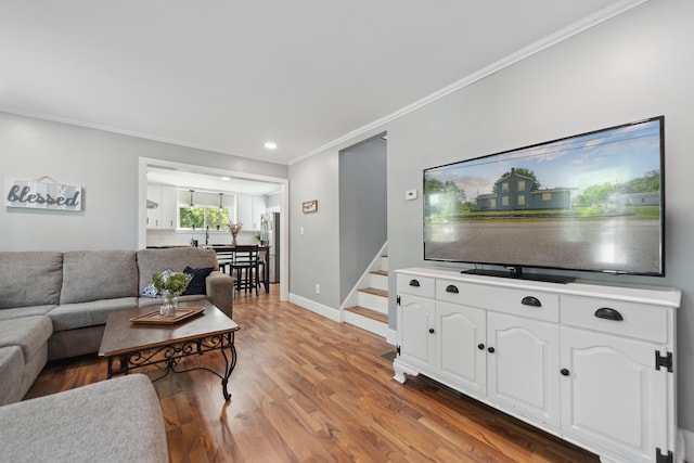 229 Water St, Grass Lake, MI 49240 - living room with ornamental molding, stairs, light wood-style floors, baseboards, and recessed lighting