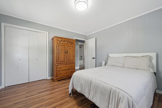 229 Water St, Grass Lake, MI 49240 - bedroom featuring wood finished floors, a closet, and ornamental molding