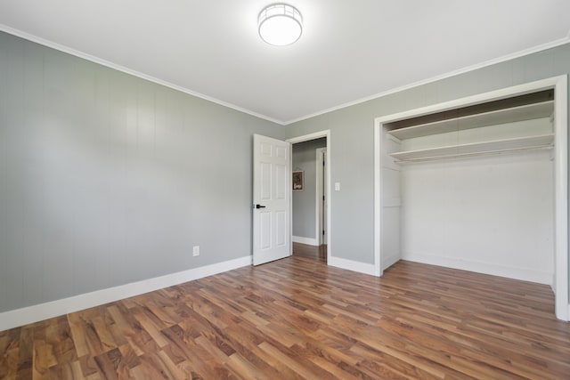 229 Water St, Grass Lake, MI 49240 - unfurnished bedroom featuring wood finished floors, a closet, ornamental molding, and baseboards
