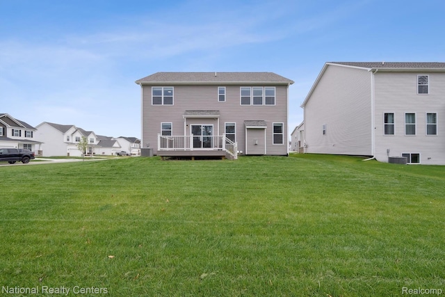 222 Quartz Way, White Lake, MI 48386 - rear view of property featuring a wooden deck, a lawn, and central AC unit