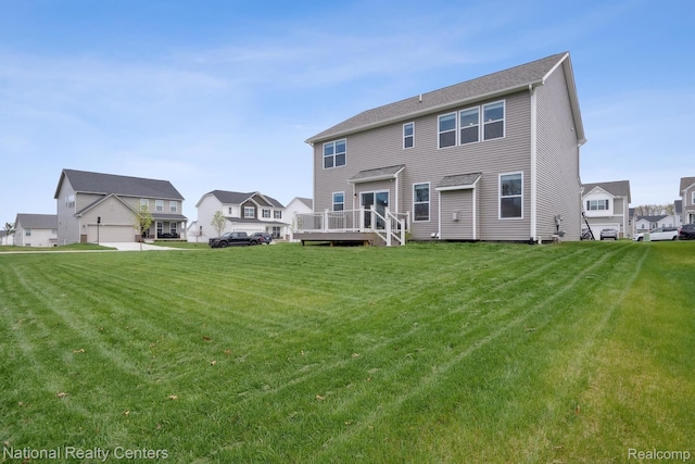 222 Quartz Way, White Lake, MI 48386 - rear view of house with a wooden deck, a yard, and a residential view